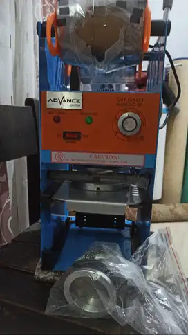 mesin press sealer cup advance