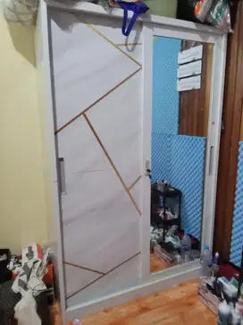 Lemari pintu sleding bahan besi
