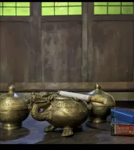 patung antik logam naga