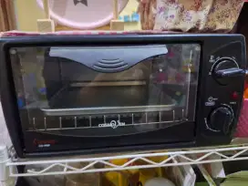 Oven Cosmos tipe 9909 dengan warna hitam, kondisi second mulus Fullset