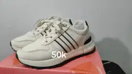 Sepatu Genny sekali pake