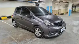 DP MURAH Honda Brio Satya 1.2 E Bensin-AT 2017 Abu-Abu CBMPB