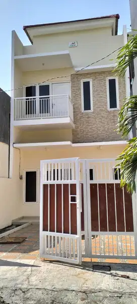 Rumah cantik 2 lantai DP minim Wiguna