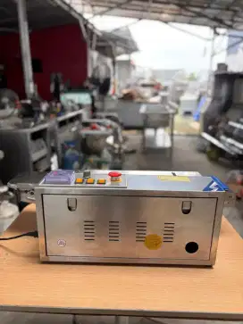 Mesin continuous band Sealer