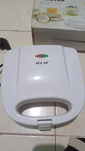 Pemanggang roti listrik merk SEKAI