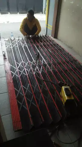 Tukang servis rolling door panggilan murah