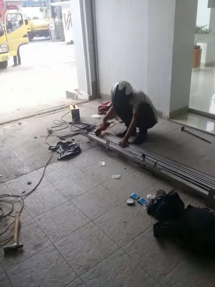 Tukang perbaikan rolling door folding gate murah
