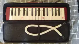 Harmonika tiup QI MEI