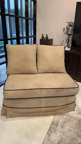 armless sofa beige with black list