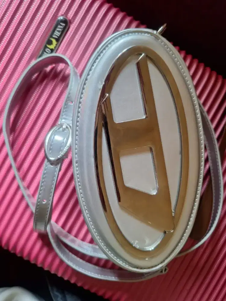 Tas selempang diesel coin