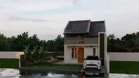 Rumah kota malang hook dengan halaman yang luas dan taman yang asri