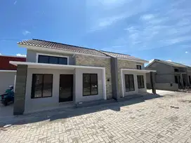 Rumah cluster Pesan Bangun pinggir jalan ramai