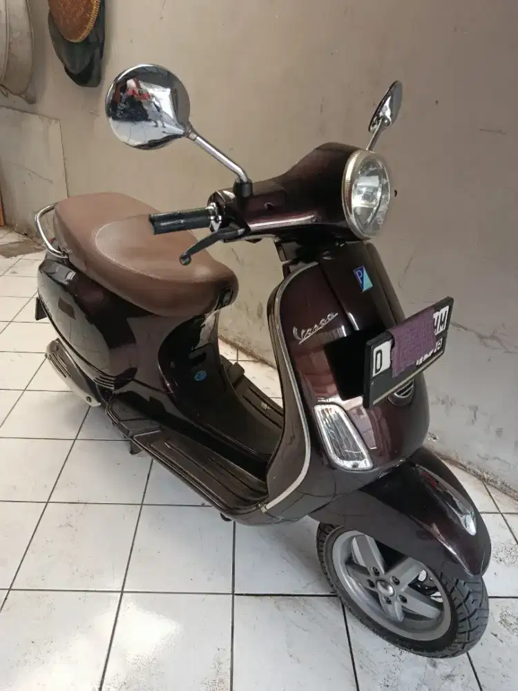 Jl.vespa LX 150 coklat tua antik km 9695