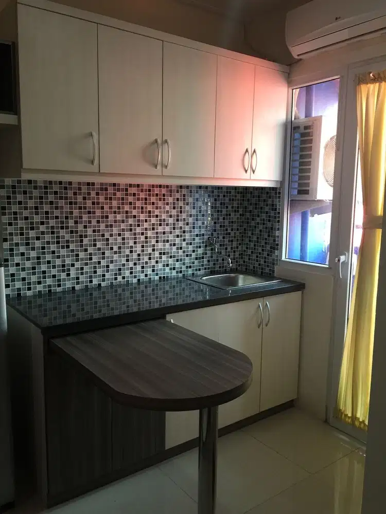 Apartemen the green pramuka city studio furnish tower