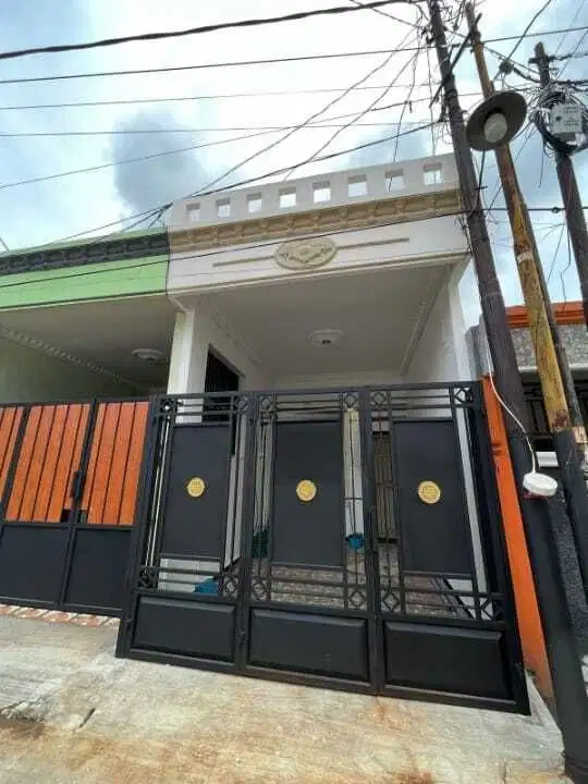 RUMAH 1,5 LANTAI DI PORIS INDAH