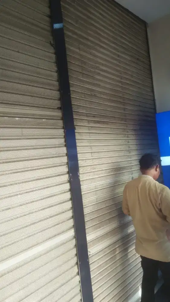 spesialis service folding gate rolling door