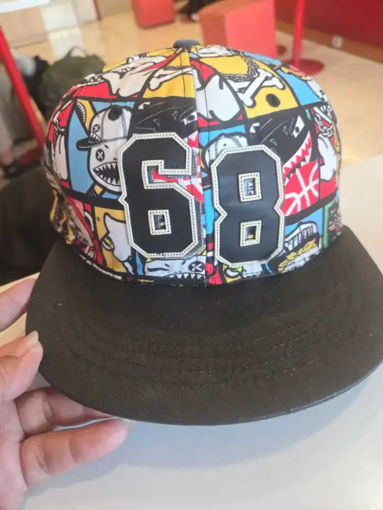 topi merk elstinko