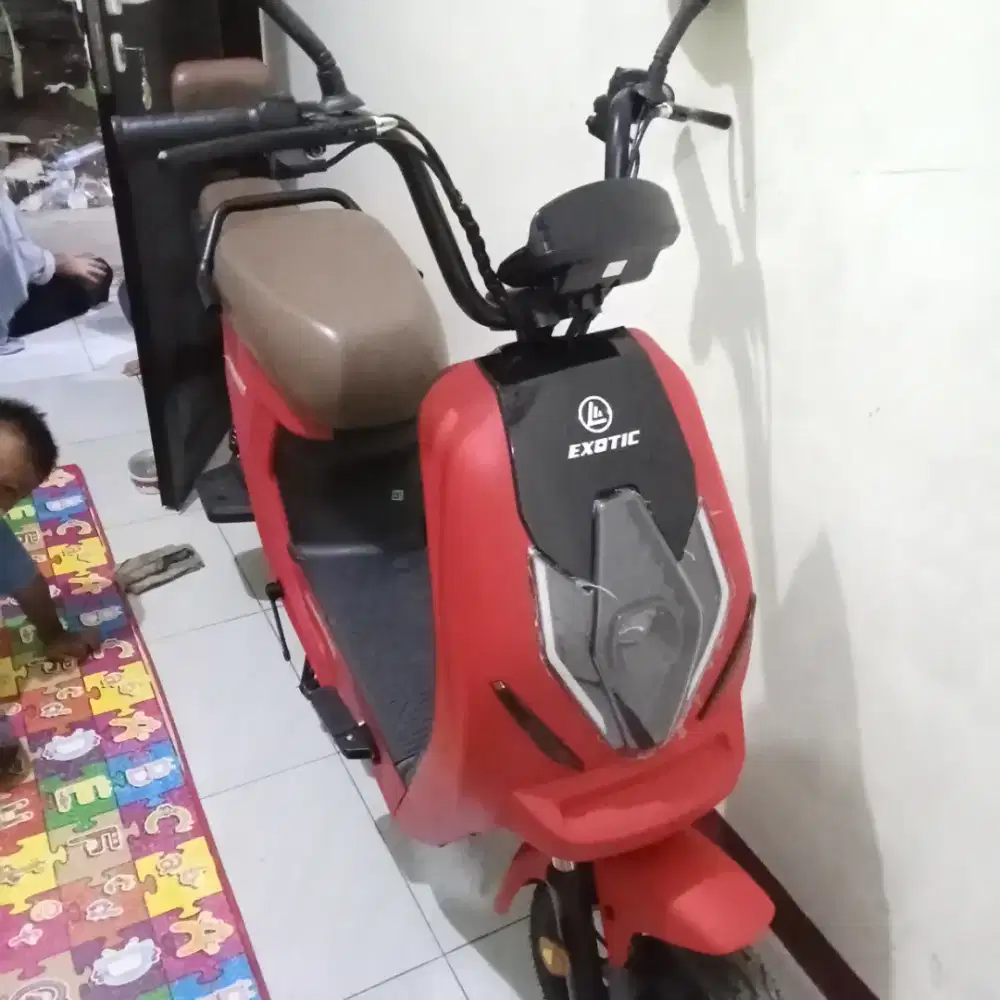Sepeda listrik Exotic X660 merah, pemakaian baru 5 bulan