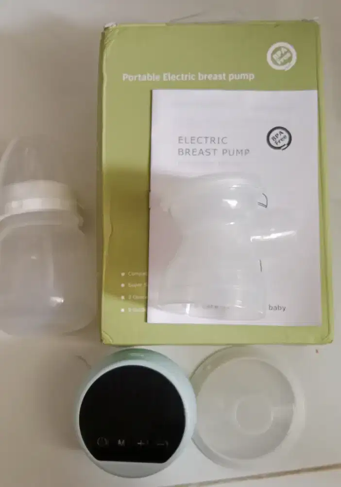 Portable electric breast pump