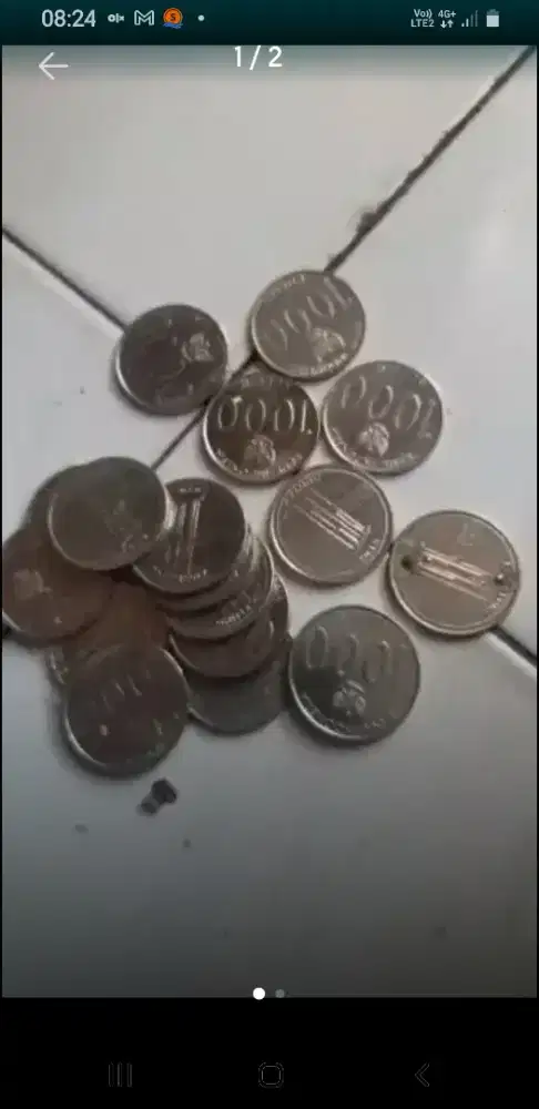 Uang koin Rp1000; motif Gedung Sate & Angklung th.2010.