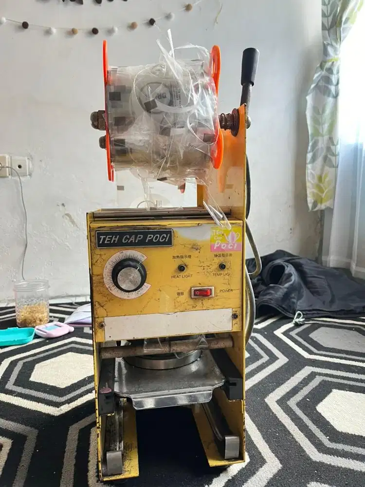 Mesin press merk teh poci