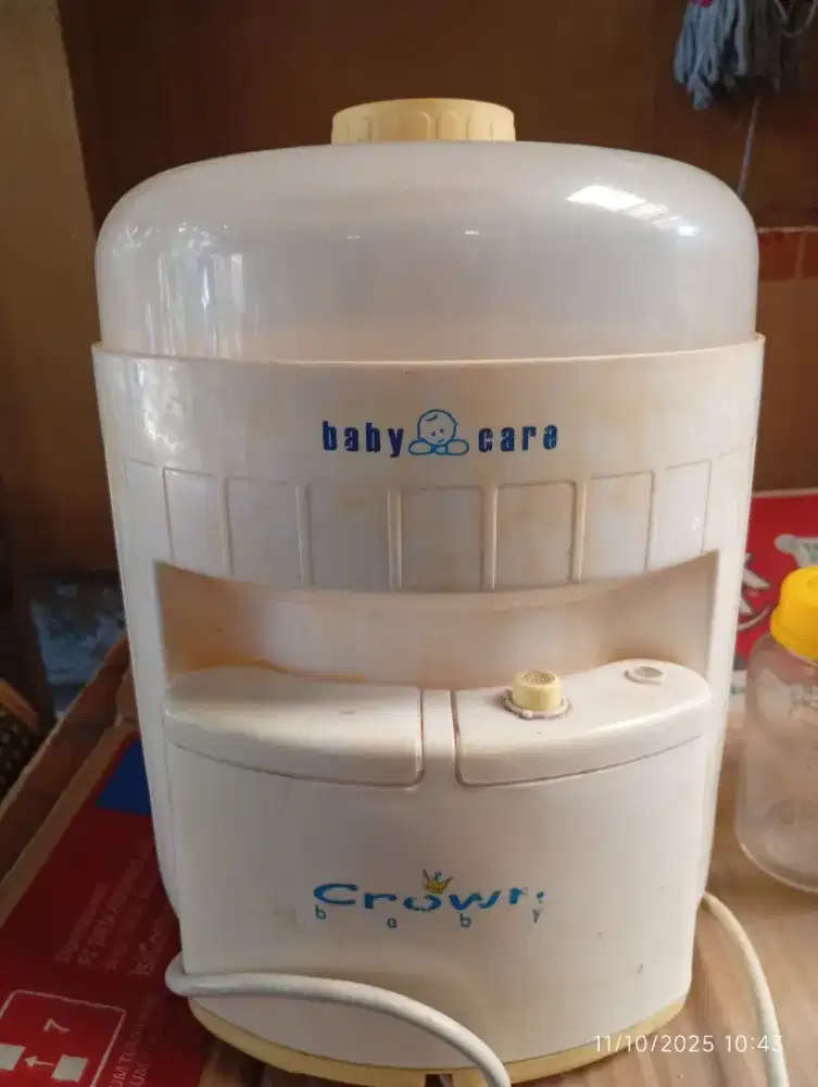 Pembersih dan penghangat botol