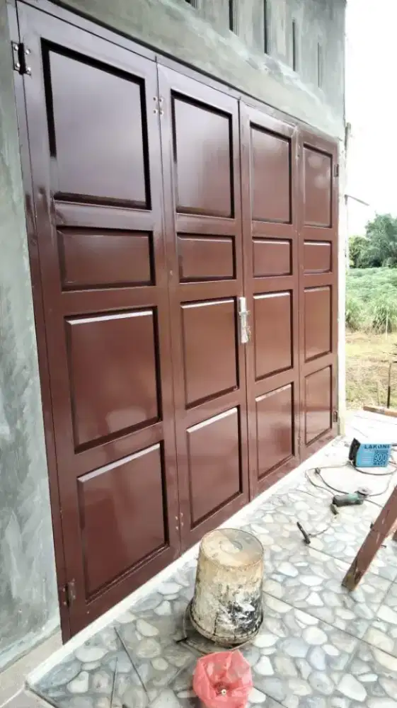 Pintu besi plat ruko dan garasi