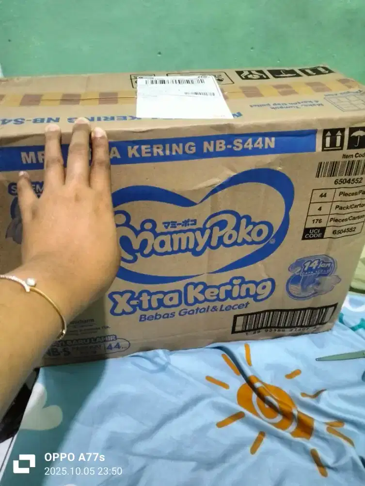 Jual pempes Mamy Poko ukuran NBs 1 dus isi 4ball,sama ayunan per