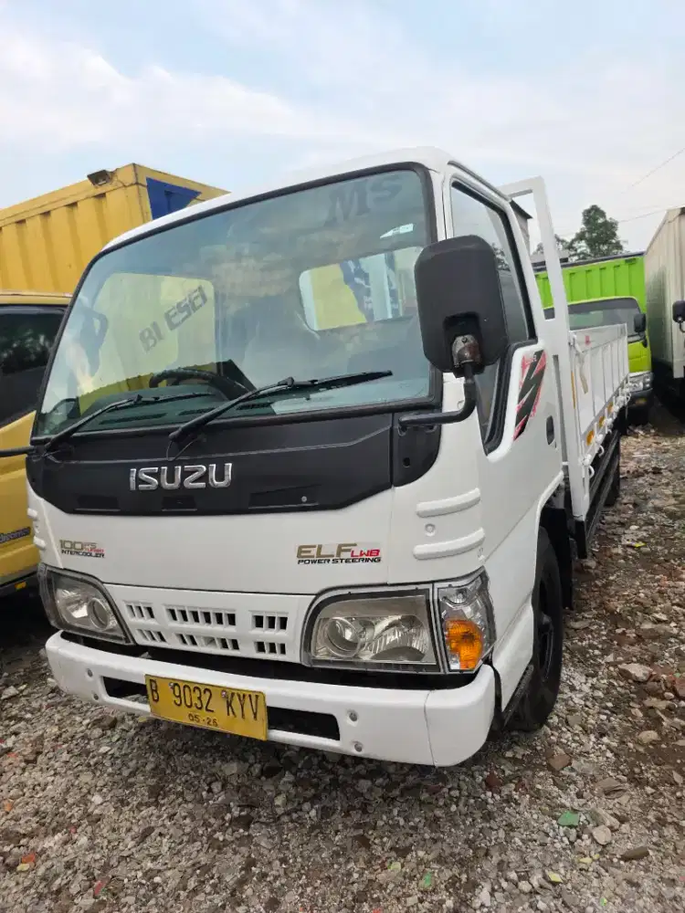 Isuzu elf nkr 55 long sasis  bak tri way