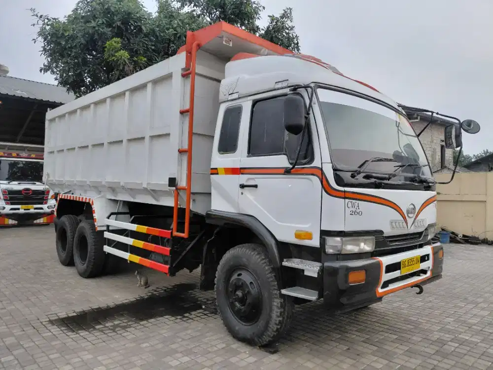 DUMP TRUK NISSAN CWA 260 TAHUN 2014 TRONTON 6X4 DOUBEL GARDAN 