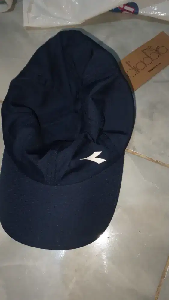 topi diadora masih baru