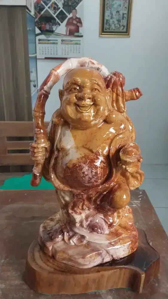 Patung dewa uang dari batu alam