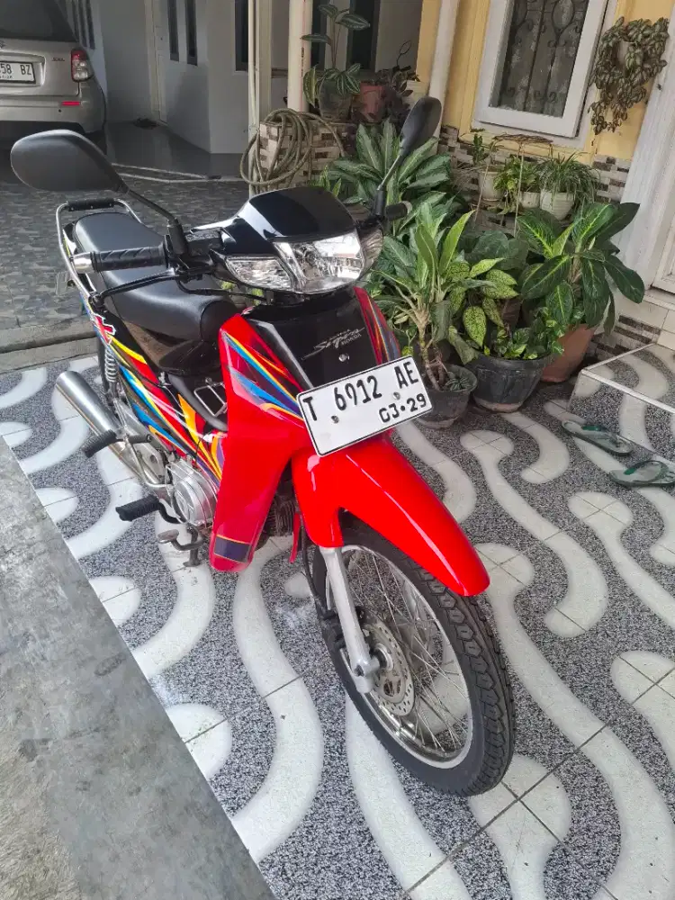 Honda Supra X merah hitam