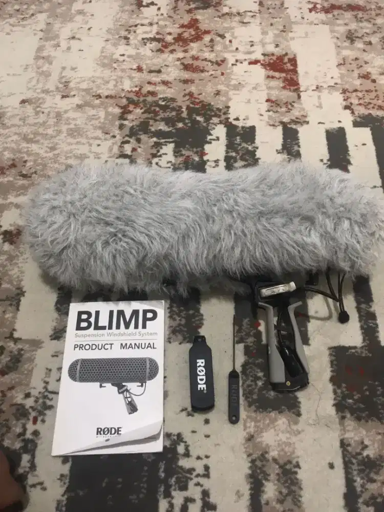 Blimp rode wind shield and shock mount system
