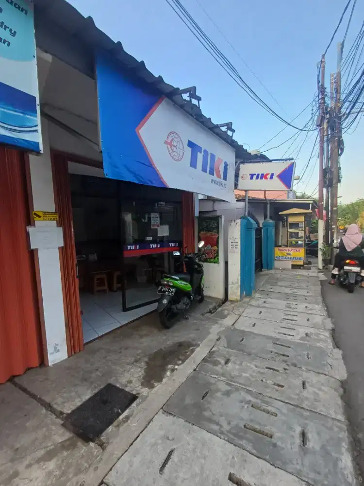Over usaha tiki