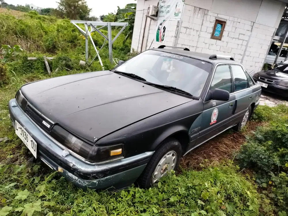 Mazda Capela Sport 1990 Bensin Surat hidup plat (L) putih powerwindos