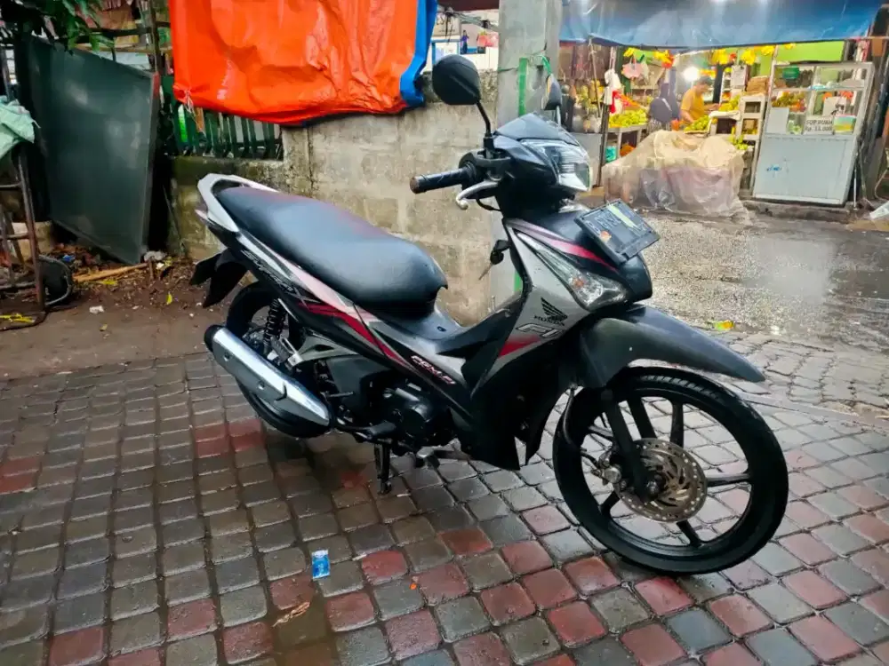 Honda Supra Helm in 125cc PGM-FI Tahun 2013
