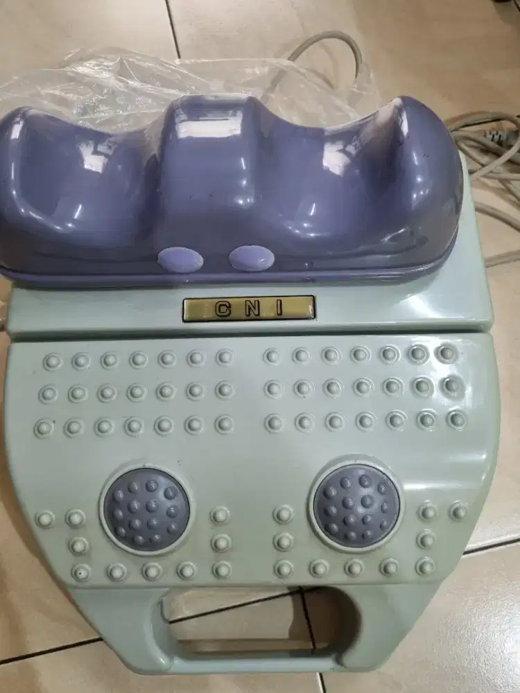 Mesin pemijat kaki merk CNI