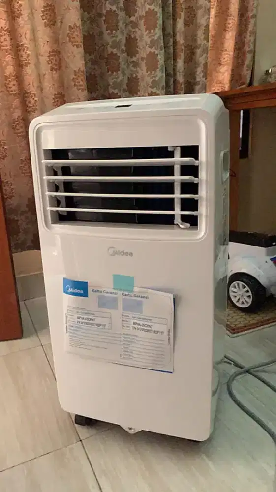 AC portable merk midea ½pk