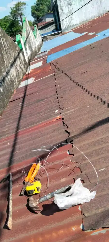 Tukang perbaikan atap bocor dinding dak rembes talang air renovasi DLL