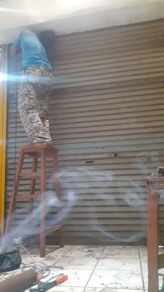 Tukang service rolling door folding gate murah