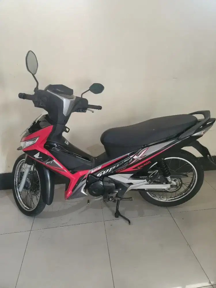 551rb/30bln Supra sw 125cc 2017 hitam merah Gbm
