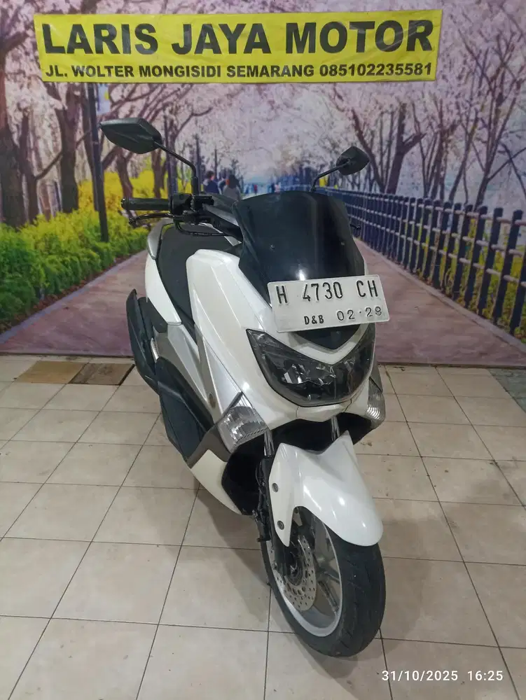 N max oll tangan pertama