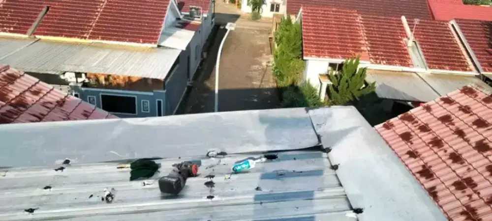 Tukang perbaikan atap bocor dinding dak rembes talang air renovasi DLL