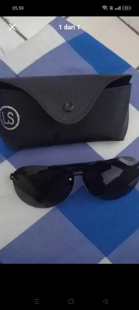 Kacamata Gelap Action