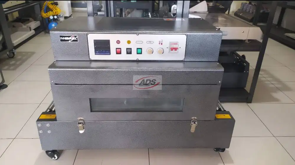 MESIN SRINK / PENGEMAS BUKU DENGAN BAHAN PLASTIK