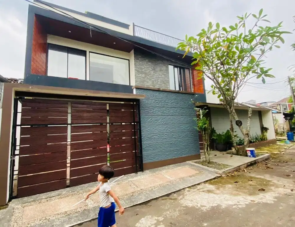 RUMAH MODERN KONTEMPORER DUA FACEADE