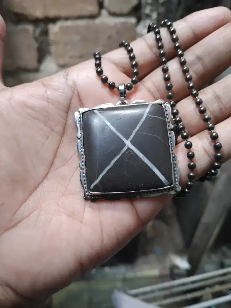 Liontin asli sri gunting