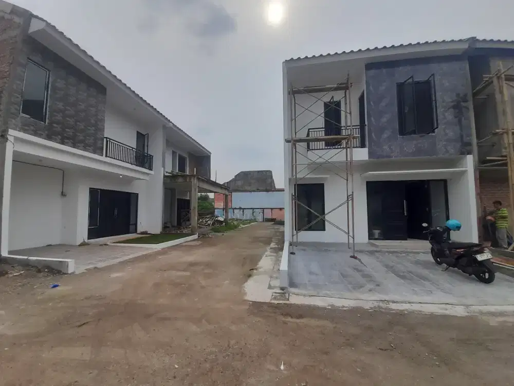 Rumah cluster mewah 2lantai super murah  lokasi pinggir jalan raya