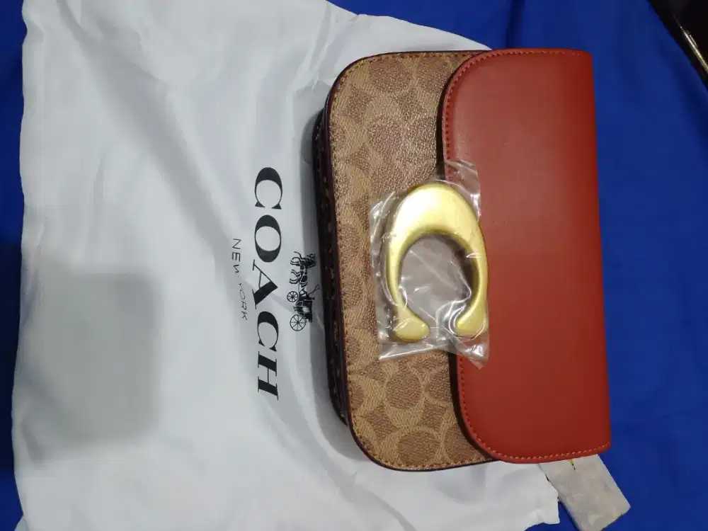 Coach signature snake skin.